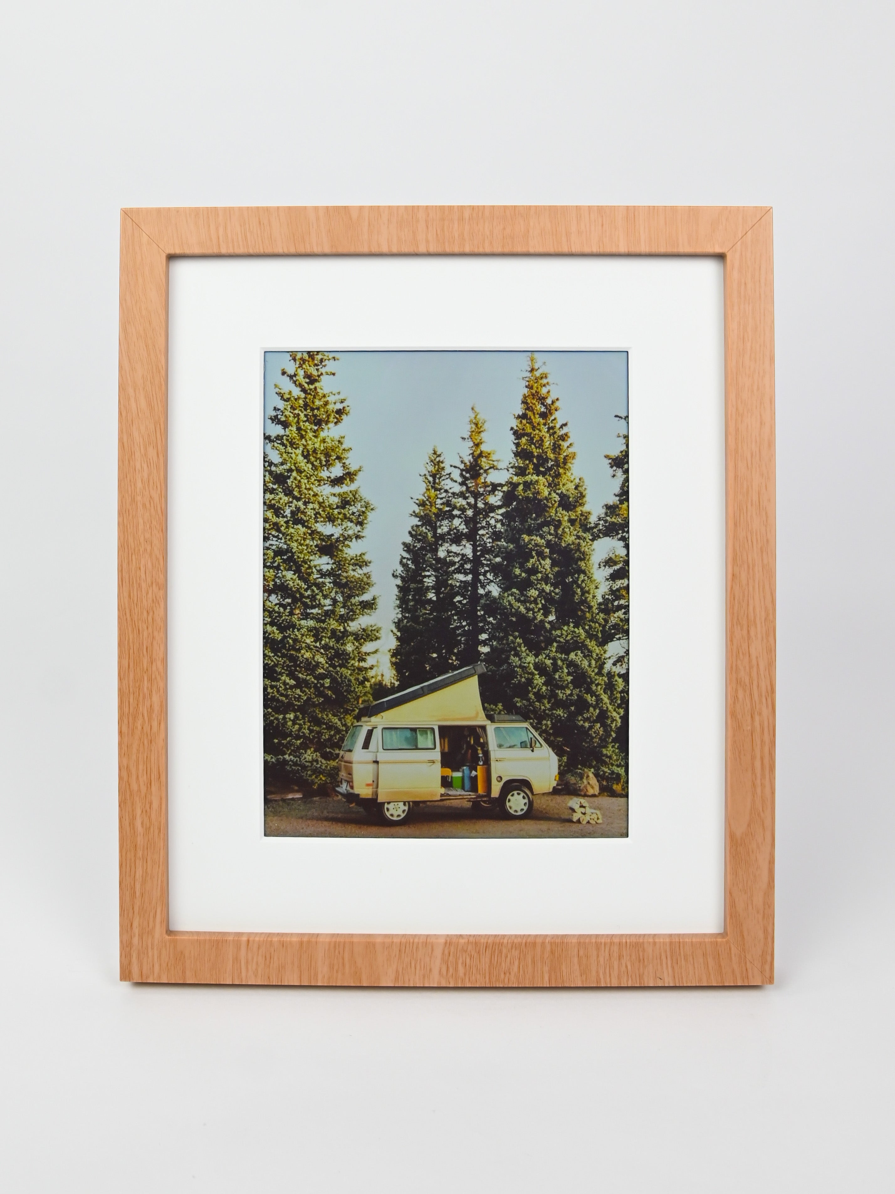 Framed photograph of a camper van in a forest with a wooden frame. #wood