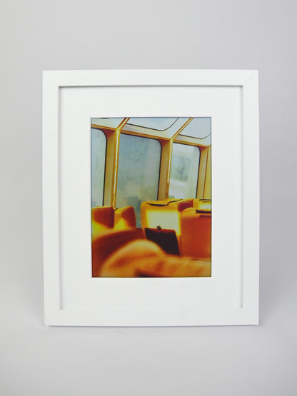 Framed photograph of a room with yellow chairs and large windows on a gray background #white
