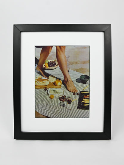 Black framed photo of a person at a table with food on a white background #black