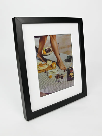 Black framed photo of a person at a table with food on a white background #black